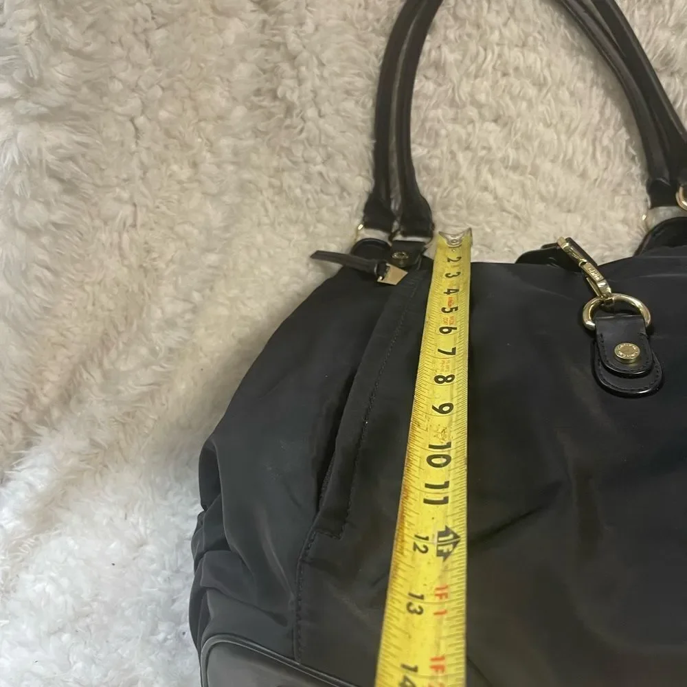 Calvin Klein Black Nylon large shoulder bag with gold tone hardwares.